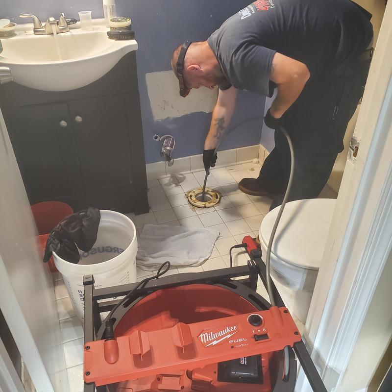 Main floor drain line clearing in bathroom toilet area