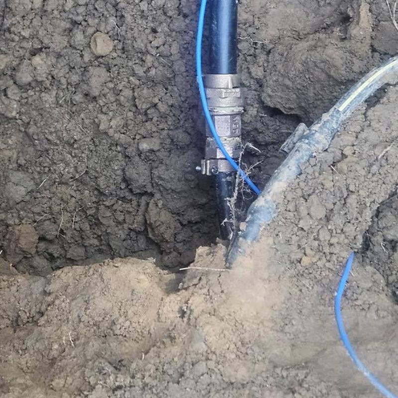 New water service pipe installation in soil trench