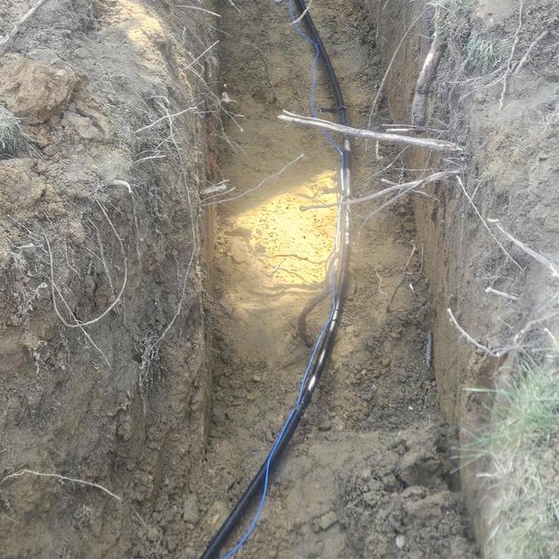 Water service line installation in trench excavation