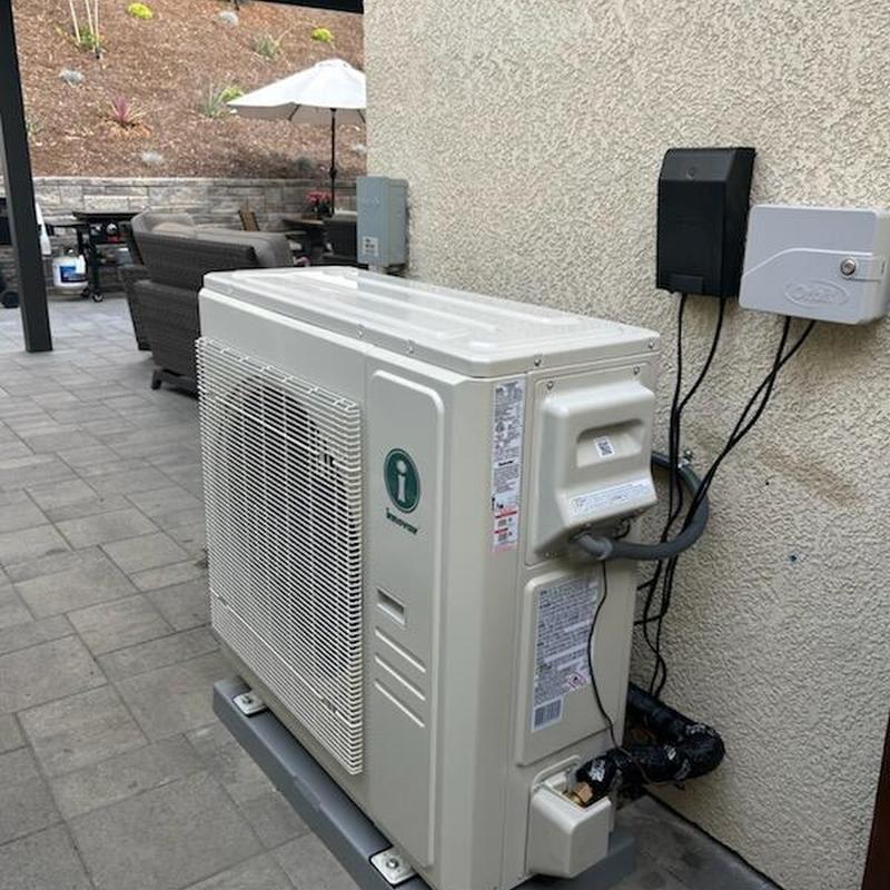 Heat pump outdoor unit installed on patio