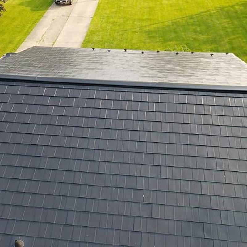 Metal roof with new flashing repair after storm damage