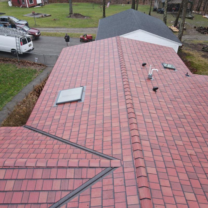 Steel Country metal roof with skylight and vents