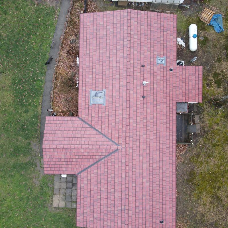 Metal shingle roof installation on residential home