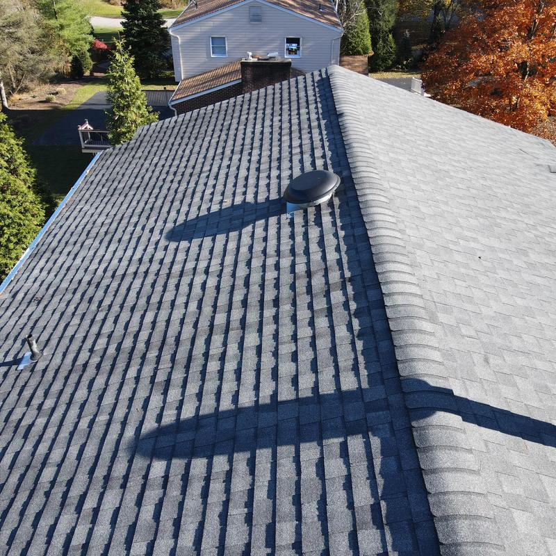 Asphalt shingle roof with vents on residential home