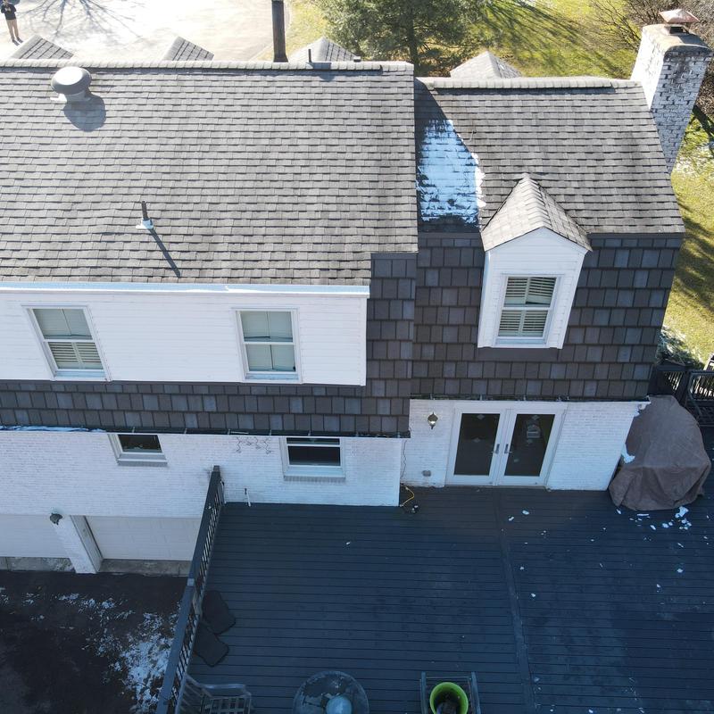 Asphalt shingle roof sections and dormer window view