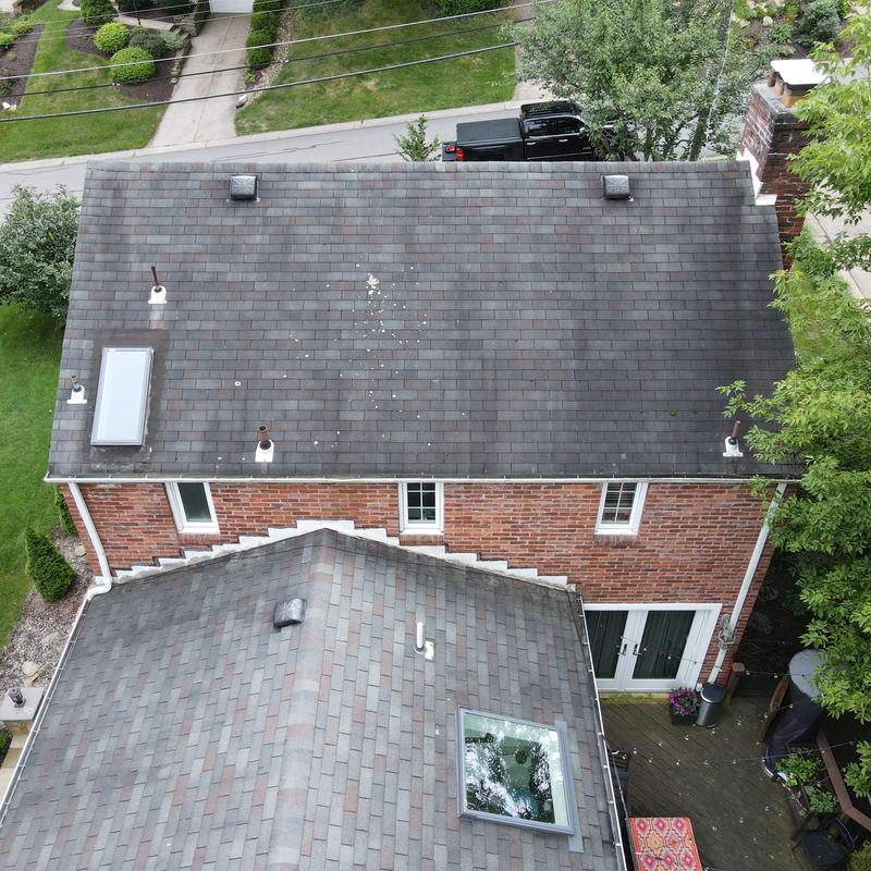 Asphalt shingle roofs with skylights on residential home