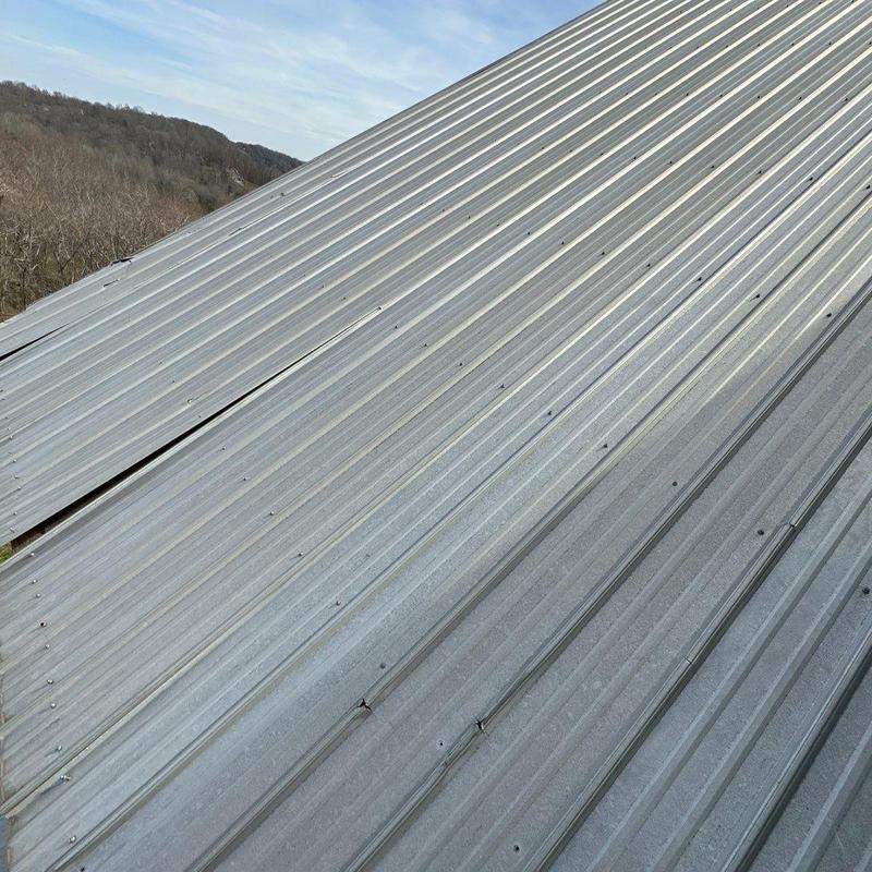 Metal roof panels with hail damage and dents