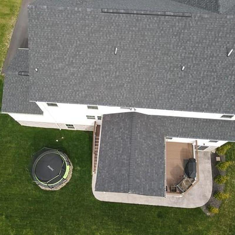 Asphalt shingle roof with new matching shingles installed