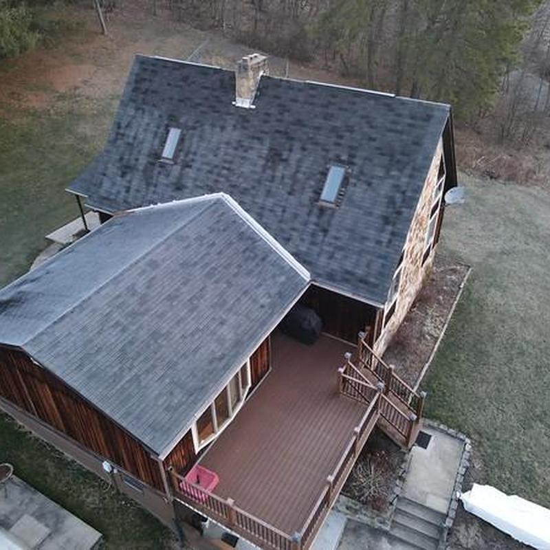 Asphalt shingle roof on residential home with skylights