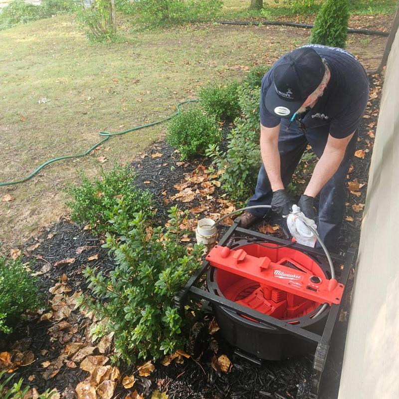 Main drain line cleaning near septic tank outdoors