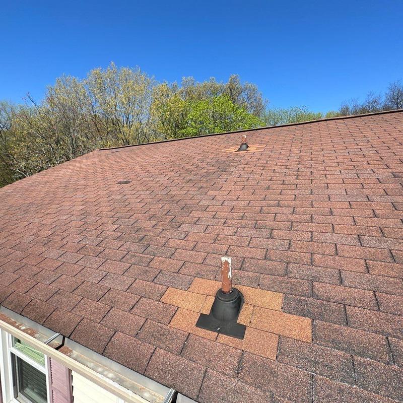 Asphalt shingles rooftop with patched vent flashing