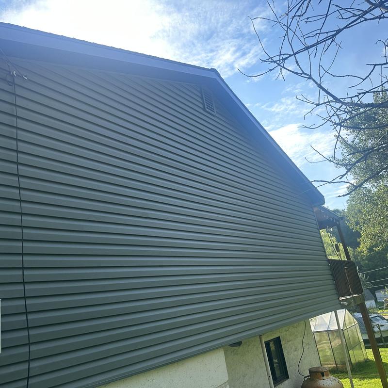 Vinyl siding installation on residential home exterior