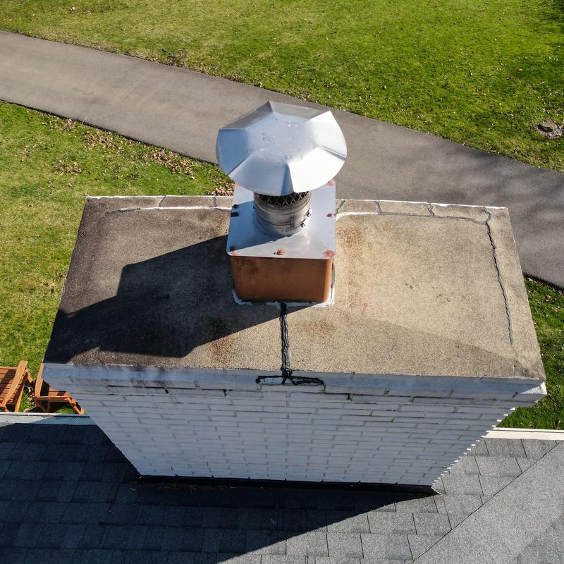 Chimney crown with epoxy seal and metal cap