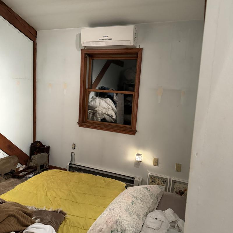 Mini-split air conditioner installation above window