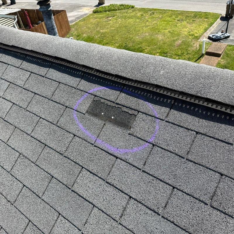 Asphalt shingles with damage marked for repair