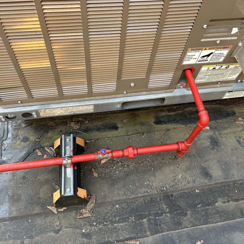 Rooftop fire sprinkler piping with valve and HVAC unit