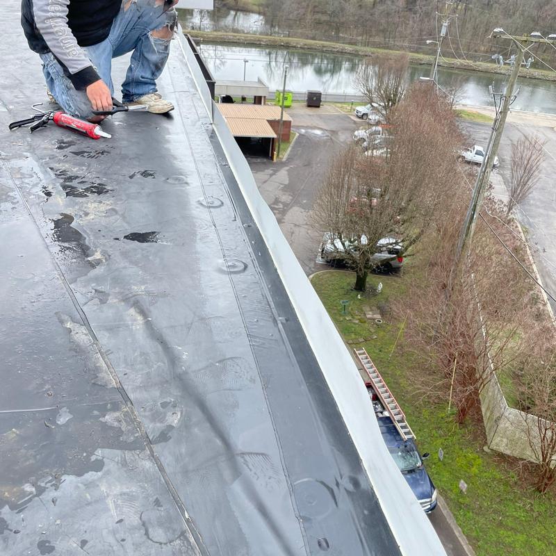 Commercial flat roof edge with repair materials