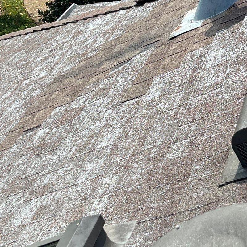 Storm-damaged roof shingles and flashing inspection in Nashville