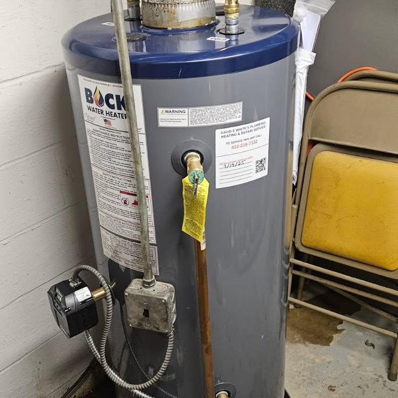 Oil-fired water heater installation in utility room