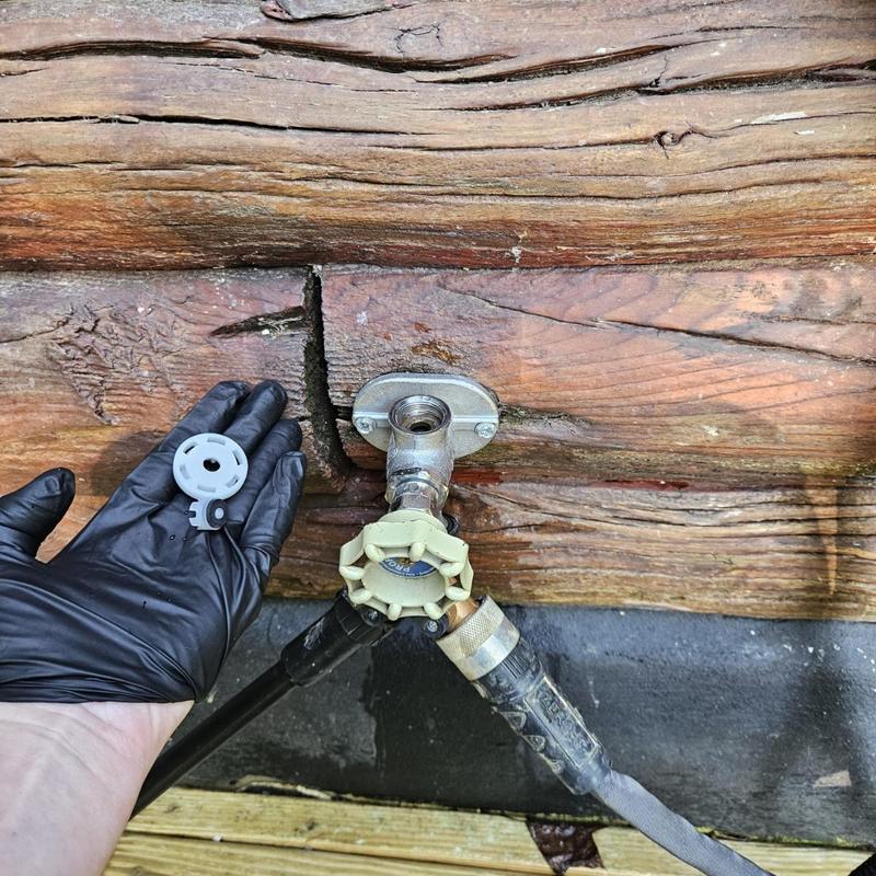 Hose bib vacuum breaker installation with glove hand