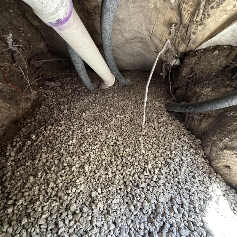 Insulated pipes in tunnel backfilled with #67 stone