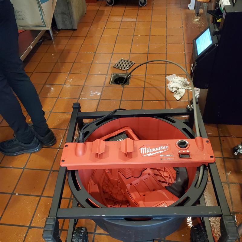 Commercial floor drain cleaning machine in restaurant