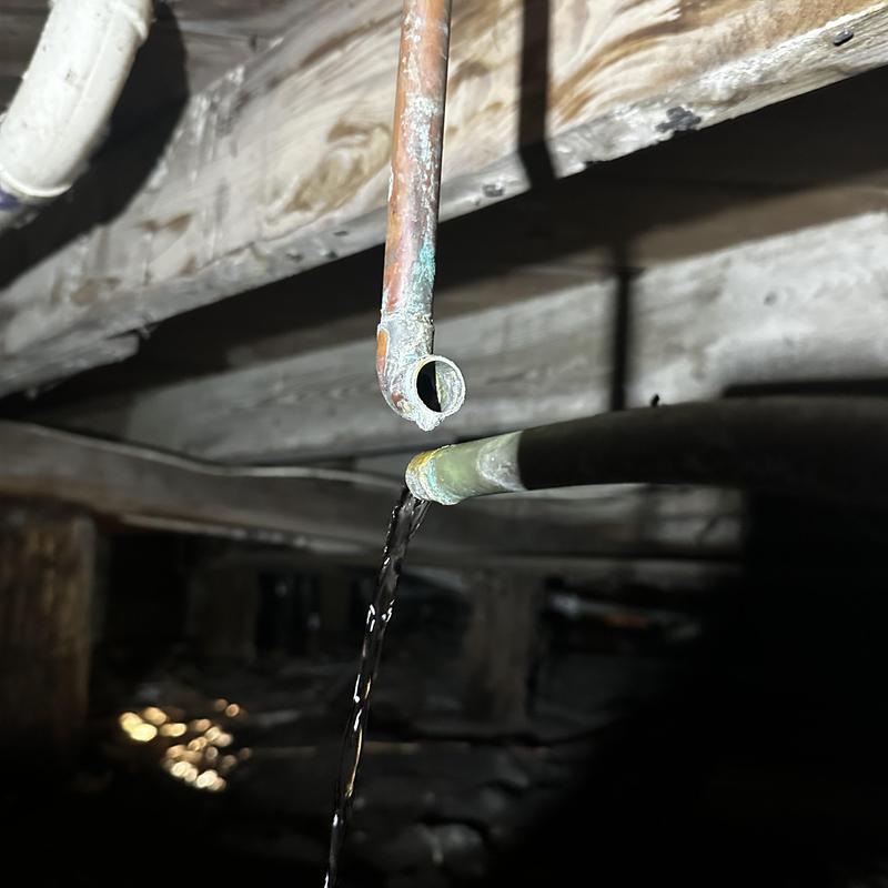 Copper pipe 90 joint leak with water dripping below wood floor joists
