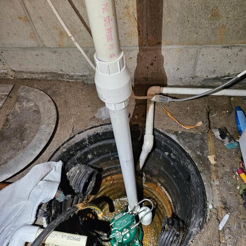 Zoeller sump pump installation in basement pit