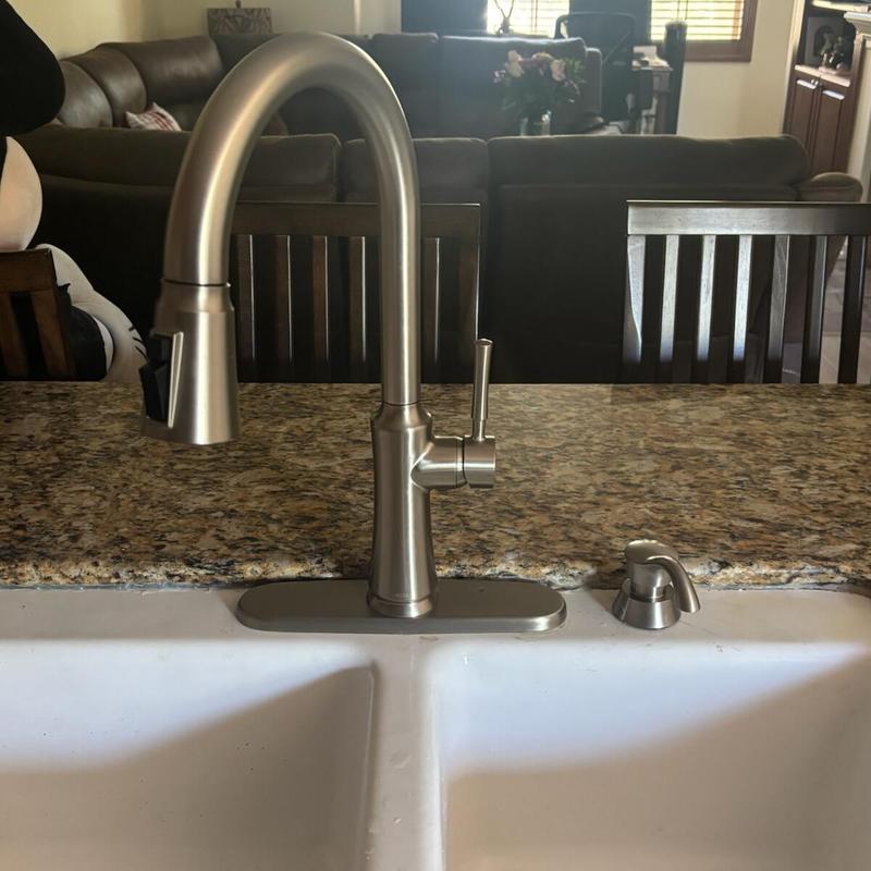 Kitchen pull out spray faucet on granite countertop