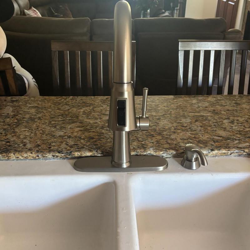 Kitchen pull out spray faucet on granite countertop
