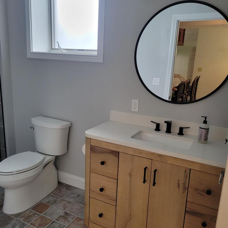 State-of-the-art glass shower with tile floor grout