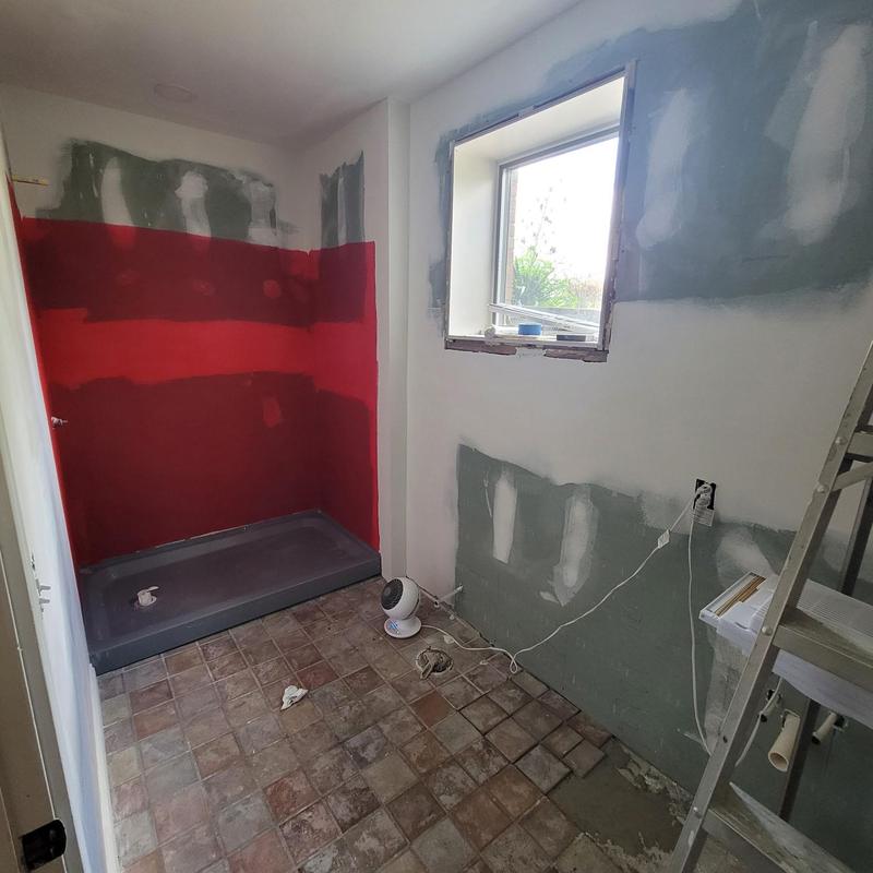 Shower base and tiling during bathroom remodel