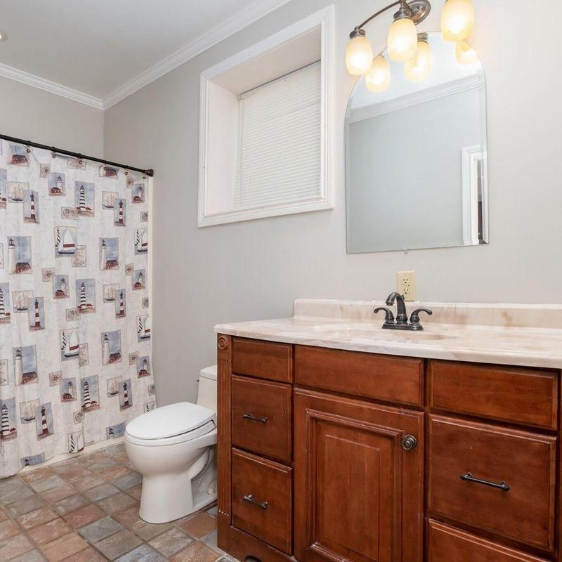 Glass sliding shower doors with tile floor grout