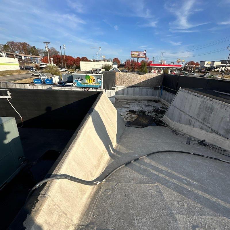 Commercial flat roof with storm damage inspection in Nashville