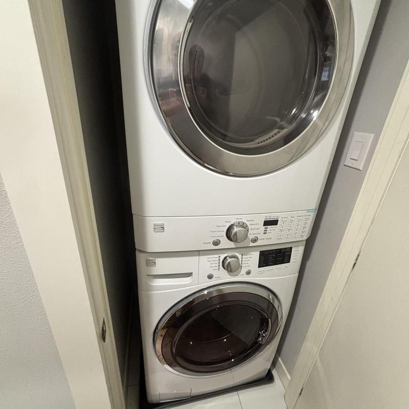 Stacked front-load washer and dryer in laundry closet