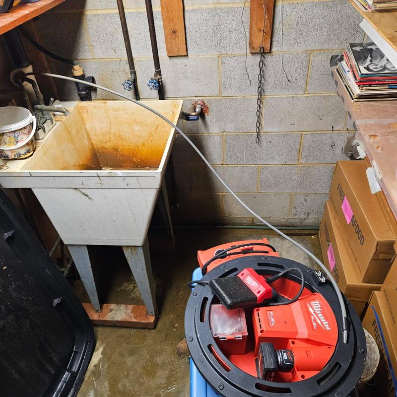 Laundry tub drain line with cleaning equipment