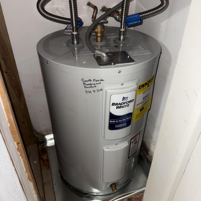 30-gallon electric water heater installed in garage