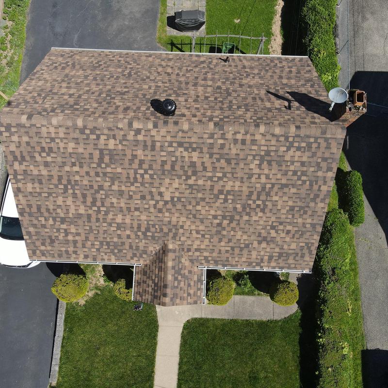 Roof ventilation turbine on brown shingle roof in Pittsburgh