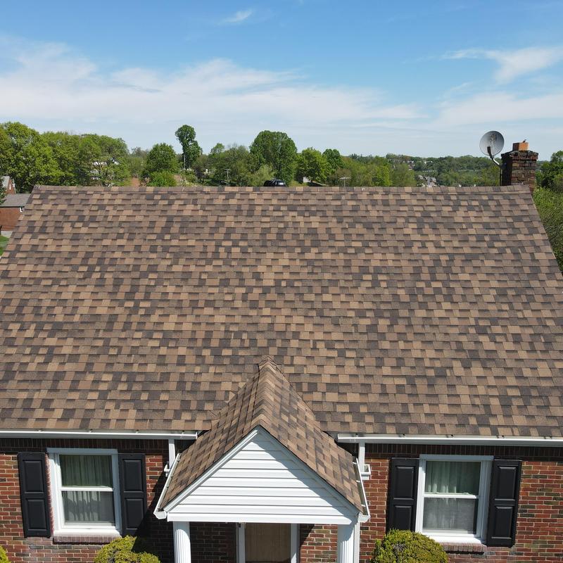 Roof shingles and ridge vent ventilation system on house roof