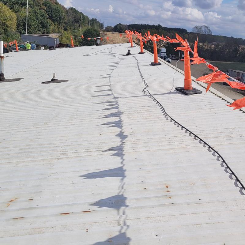 Commercial metal roof with safety flagging installed