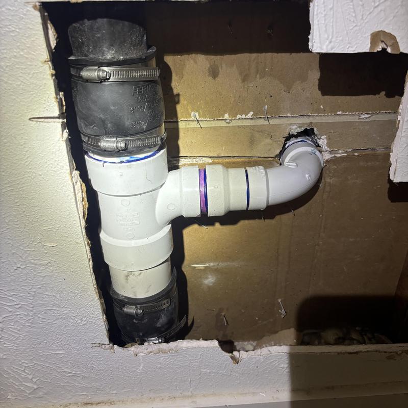 Bathroom sink drain line with PVC and rubber fittings