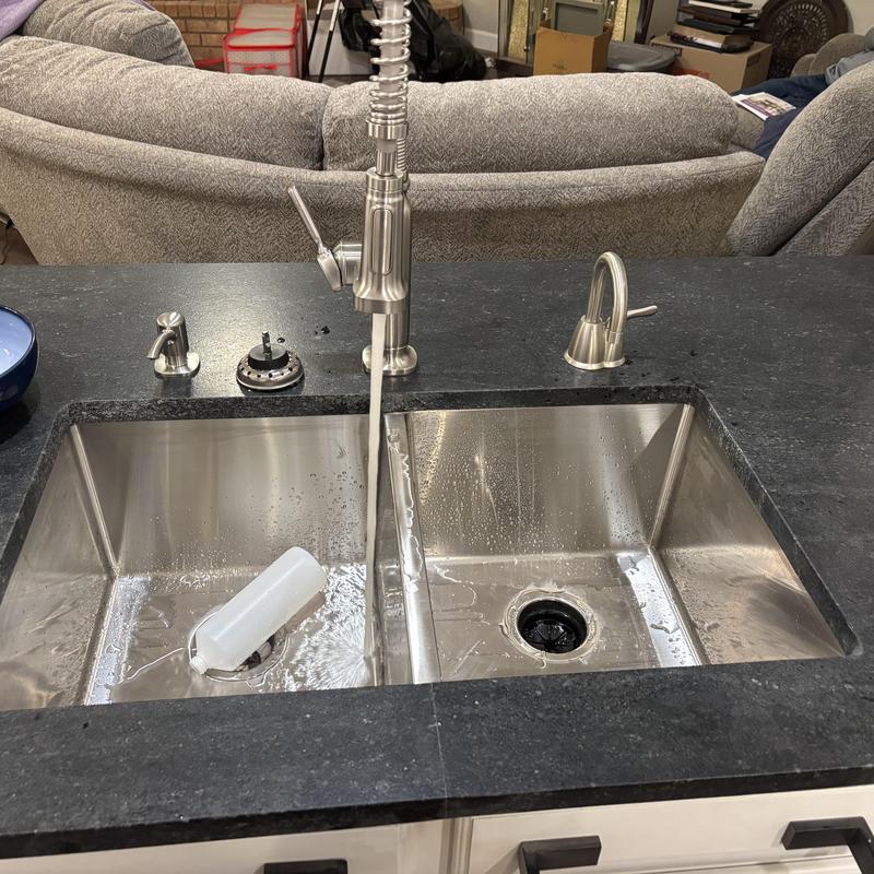 Double stainless steel kitchen sink with faucet installation