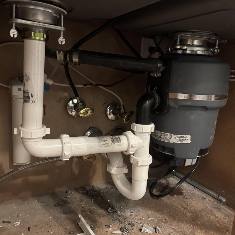 Garbage disposal and PVC sink drainage installation