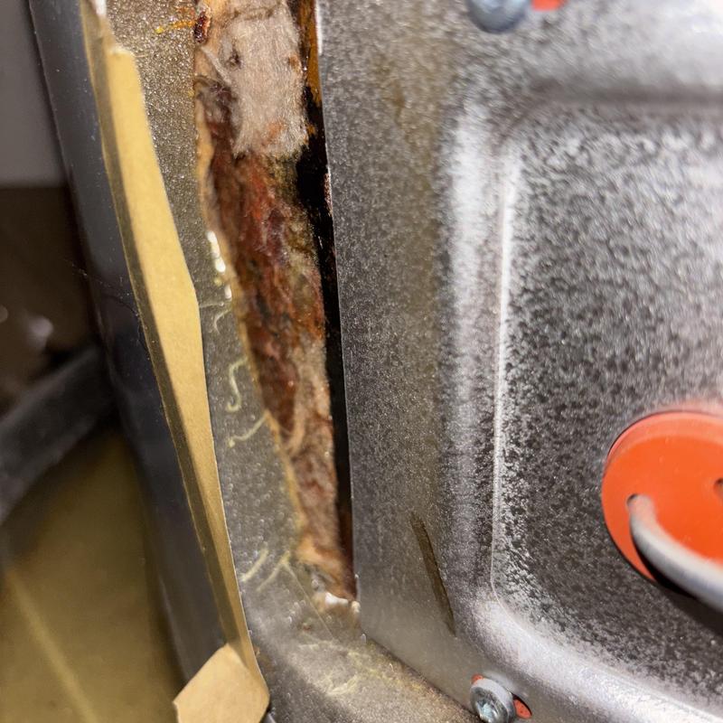 Water heater rusted leak area close-up inspection