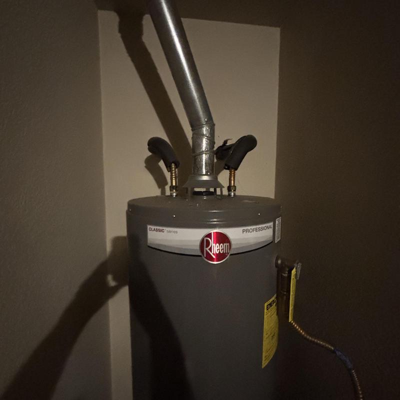 Water heater with vent pipe and copper fittings