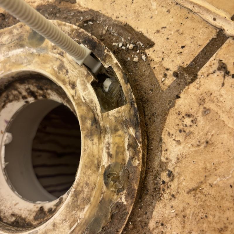 Toilet flange extension installation on tiled floor