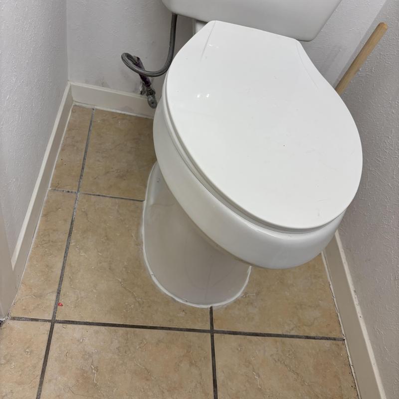 Toilet flange with extension installed under base