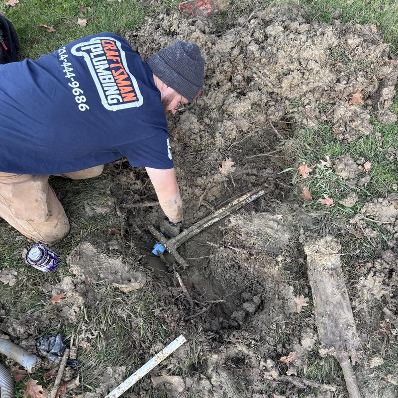 PVC yard main water line leak repair in muddy soil