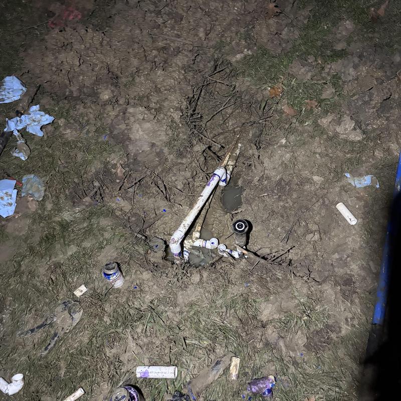 PVC main yard line with leak repair in soil