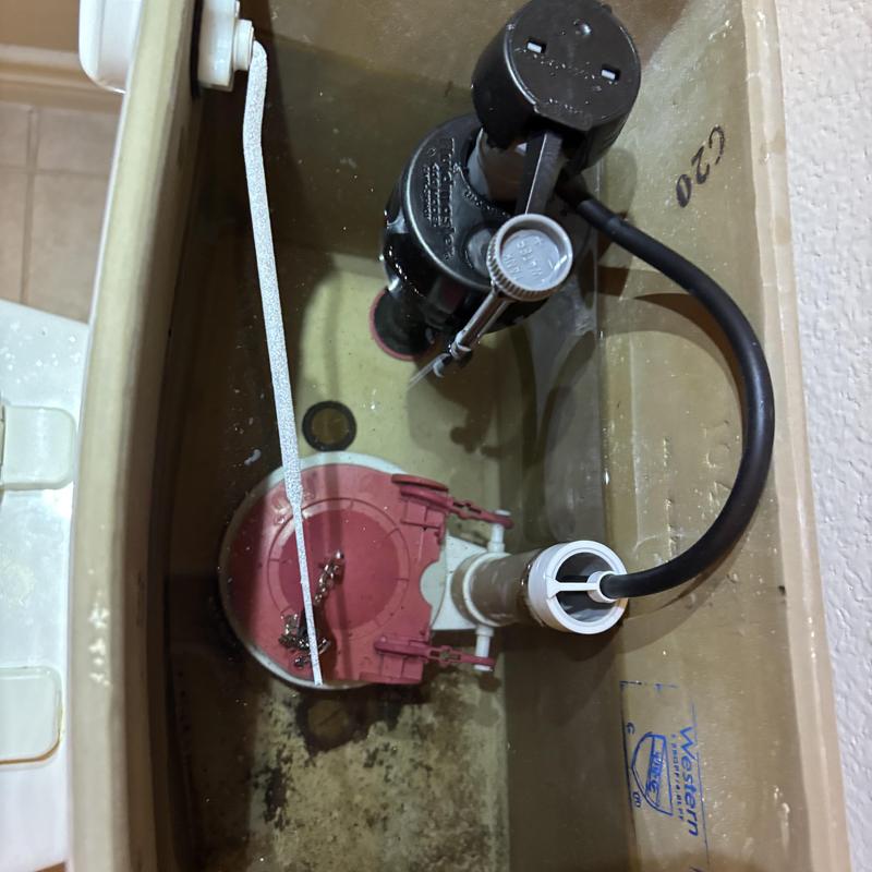 Toilet flapper and fill valve inside tank